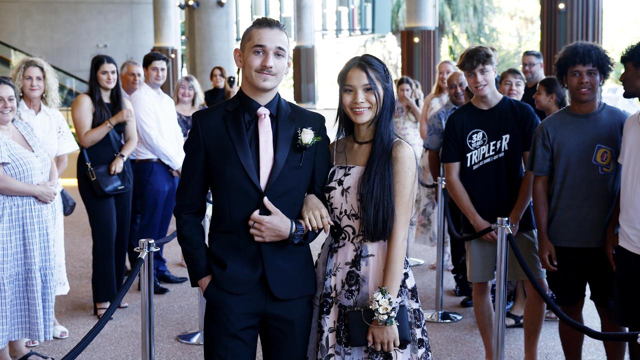 Melody Neal arrives at the Peace Lutheran College formal evening at the Cairns Convention Centre with her date Hunter Smith. Ms Neal was the victim of a stabbing at the school on May 16, which damaged her liver and severed nerves in her spine. Picture: Brendan Radke