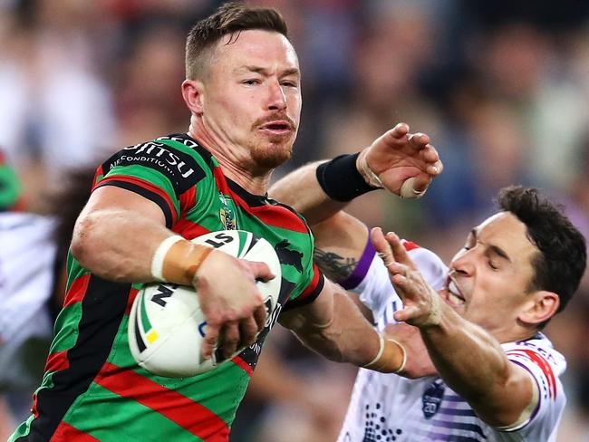 SYDNEY, AUSTRALIA - AUGUST 03: Damien Cook of the Rabbitohs evades the tackle of Billy Slater of the Storm as he breaks away to score a try during the round 21 NRL match between the South Sydney Rabbitohs and the Melbourne Storm at ANZ Stadium on August 3, 2018 in Sydney, Australia. (Photo by Mark Kolbe/Getty Images)