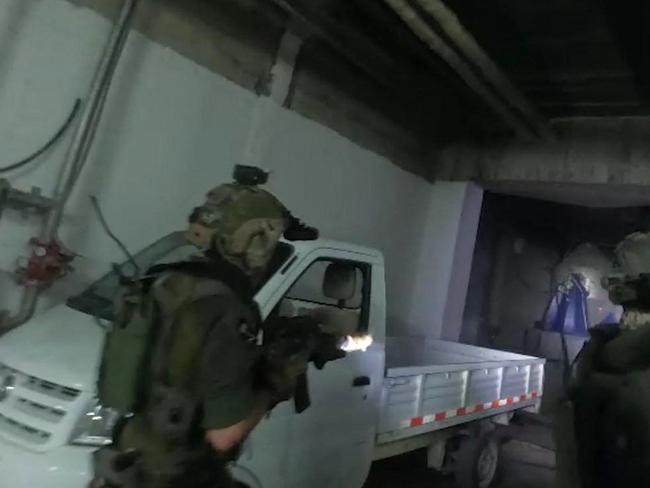 This handout picture released by the Israeli army on January 2, 2025, shows troops during a reported raid on a facility in Syria's Masyaf area near the Mediterranean coast. The Israeli military confirmed on Thursday that dozens of its troops were flown into Syria in September to destroy an underground missile factory funded by Iran. The military, which rarely comments on its activities inside Syria, said in a statement that the September 8 raid involved more than 100 Israeli commando soldiers who dismantled the facility in the Masyaf area near the Mediterranean coast. (Photo by Israeli Army / AFP) / === RESTRICTED TO EDITORIAL USE - MANDATORY CREDIT "AFP PHOTO / Handout / Israeli Army' - NO MARKETING NO ADVERTISING CAMPAIGNS - DISTRIBUTED AS A SERVICE TO CLIENTS ==