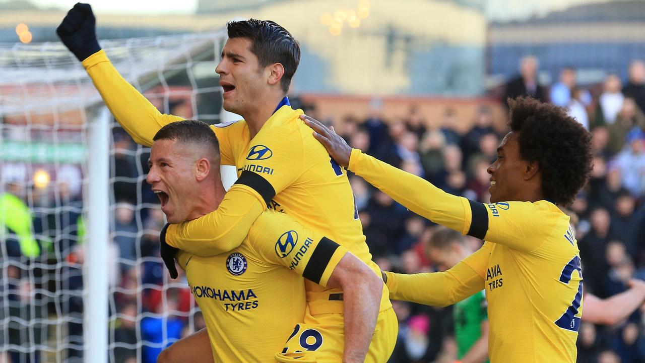 Ross Barkley (L) celebrates with Alvaro Morata (C) and Willian. (Photo by Lindsey PARNABY / AFP)