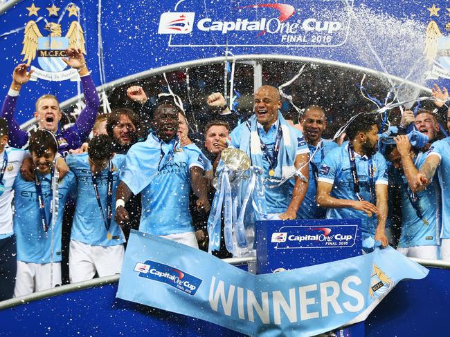 LONDON, ENGLAND - FEBRUARY 28: Vincent Kompany of Manchester City and team mates celebrate victory with the trophy after the Capital One Cup Final match between Liverpool and Manchester City at Wembley Stadium on February 28, 2016 in London, England. Manchester City win 3-1 on penalties. (Photo by Michael Steele/Getty Images)
