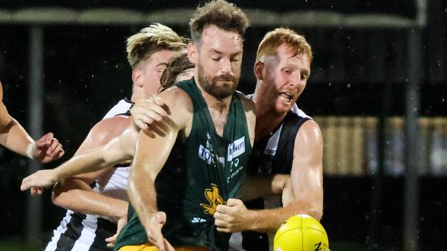 Palmerston skipper Eric Guthrie competes for the ball against Luke Hillier of St Mary's in the 2022-23 NTFL season. Picture: Celina Whan / AFLNT Media