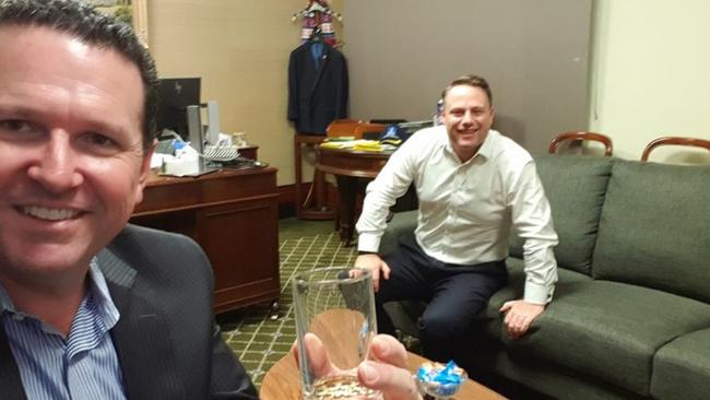 Malcolm Cole, part owner of lobbying firm SAS, celebrates the LNP’s win with Brisbane lord mayor Adrian Schrinner.