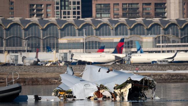 The Coast Guard investigates the crash site. Picture: Petty Officer 1st Class Brandon Giles/ U.S. Coast Guard via Getty Images