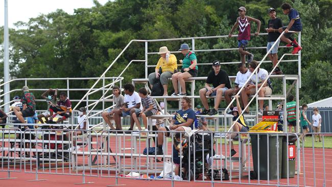 Punters watch from portable grandstands at the pre-season NRL game between the South Sydney Rabbitohs and the North Queensland Cowboys at Barlow Park. Picture: Brendan Radke