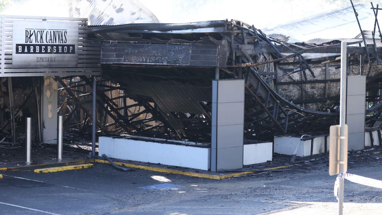 Police and firefighters at the scene of the fire. Picture: Peter Wallis