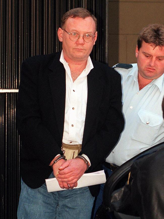 Lindsey Robert Rose arrives at the NSW Supreme Court in handcuffs in 1998. He pleaded guilty to five murder charges.