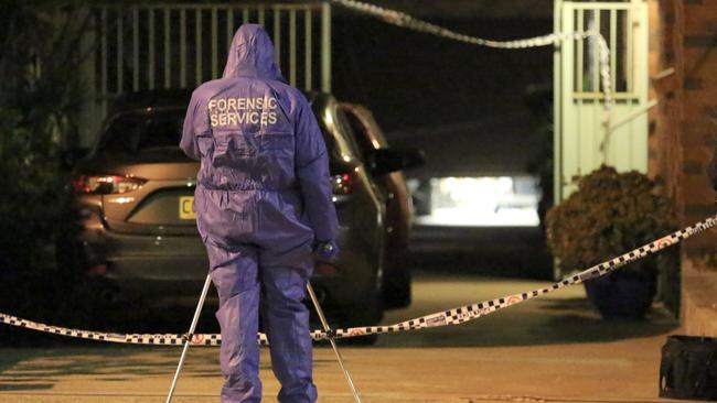 The police forensic team at the scene on Sunday. Picture: Steve Tyson