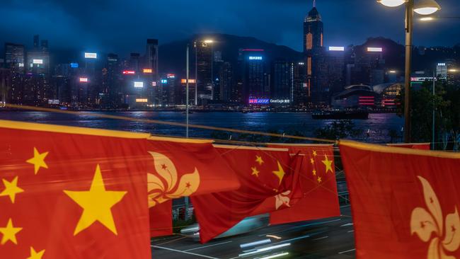 The flags of China and Hong Kong against the city's skyline on June 30. Picture: Anthony Kwan/Getty Images.