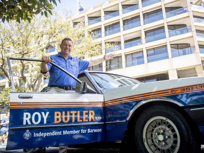 Roy Butler MP with his 1979 Ford FC LTD that he has wrapped in political branding outside NSW Parliament House . Photo Jeremy Piper