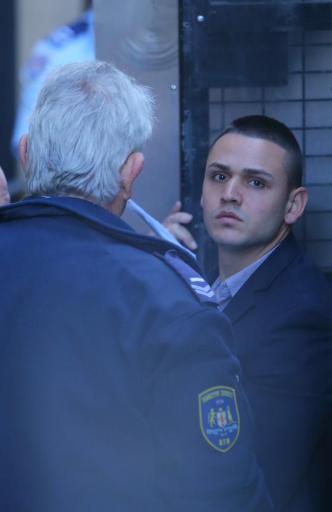 Jake Tortell is escorted into the Supreme Court. Picture: John Grainger