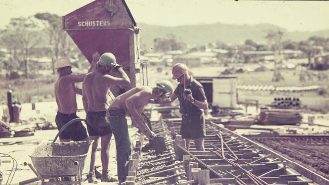 Four men working on a concrete pour during construction of the Riverside Expressway, Brisbane. Photo: Gordon Foot/State Library of Queensland