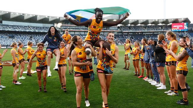 Hawks Tegan Cunningham, left, and Akec Makur are chaired from the field after the final AFLW games. Picture: Michael Willson/AFL Photos