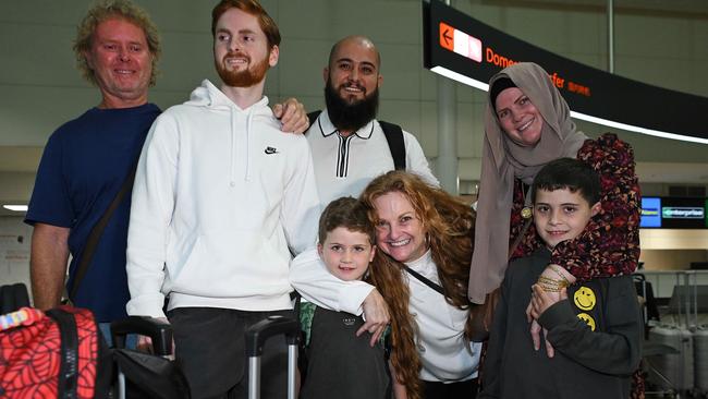 Julie Pritchard welcomes her daughter Lily Obaid and grand children Mohamad, 7, and Zaiyd, 5, at Brisbane International Airport. Picture: Lyndon Mechielsen/Courier Mail