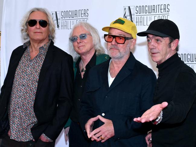 (L-R) Inductees R.E.M. band members Peter Buck, Mike Mills, Michael Stipe and Bill Berry attend the Songwriters Hall of Fame 2024 induction and awards gala at the New York Marriott Marquis Hotel in New York City on June 13, 2024. (Photo by ANGELA WEISS / AFP)