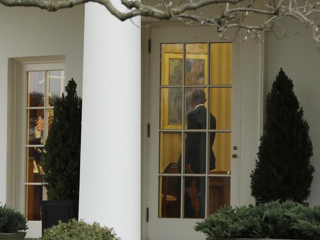 President Barack Obama stands in the Oval Office of the White House in Washington on January 20, 2017, before the start of presidential inaugural festivities for the incoming 45th President of the United States Donald Trump. Picture: AP