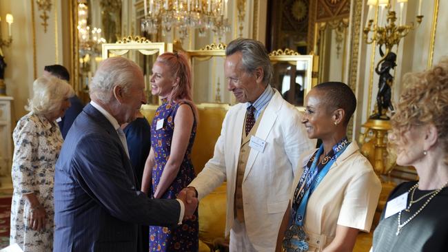 King Charles speaks with actor Richard E Grant and broadcaster Adele Roberts during a reception in celebration of community-based initiatives raising awareness about cancer at Buckingham Palace. Picture: Andrew Matthews /Getty Images