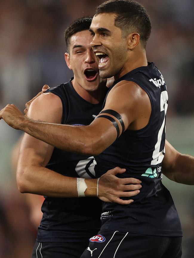 Jack Martin jugs Zac Fisher after a goal.