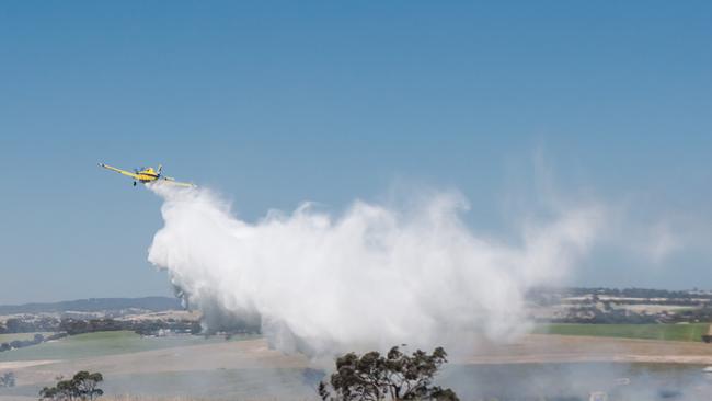 Water bombers extinguishing a fire near Roseworthy, off the Sturt Highway. Picture: Alexandra Baker