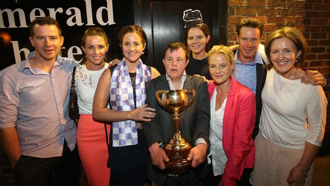 The Payne celebrate on Tuesday night. From left, Andrew, Cathy, Cup winner Michelle, Stephen, Margaret, Bernadette, Patrick and Therese. Picture: Yuri Kouzmin