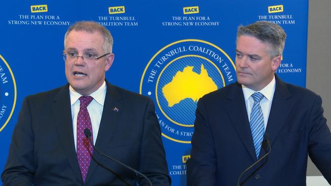 Treasurer Scott Morrison and Minister for Finance Mathias Cormann announce the coalition government's election costings. The coalition is banking on a new welfare crackdown and savings from unspent transport and community funds. Picture: Adrian Muscat