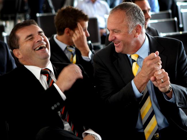 Then-Brisbane Roar coach Ange Postecoglou (L) shares a laugh with Arnold, who was coaching at Central Coast Mariners.