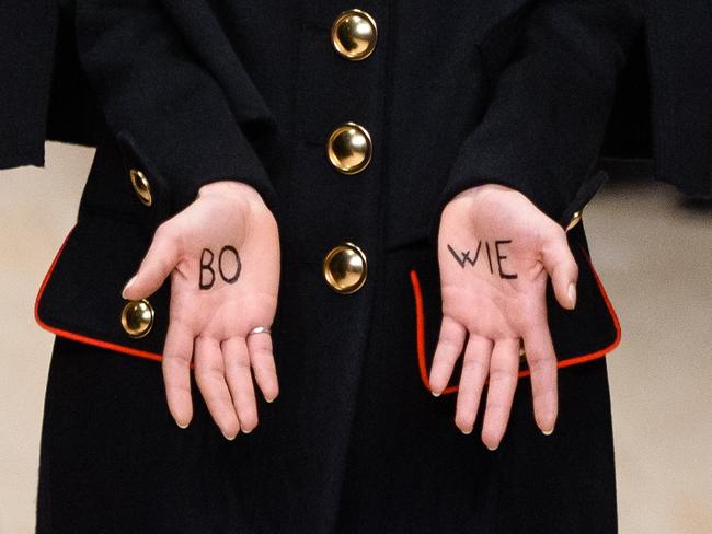 Tribute ... A model displays the word ‘Bowie" on her hands as she presents a creation by British design house Burberry Prorsum. Picture: AFP/LEON NEAL