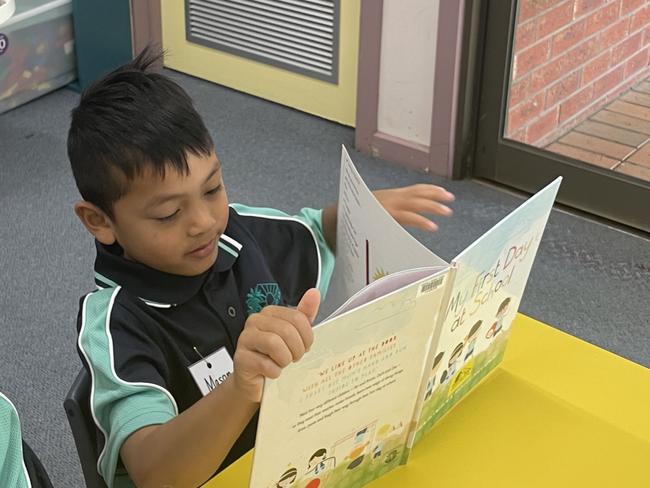 Mason was very aptly reading 'My First Day at School' on his first day at Ranfurly Primary School. Picture: Stuart Kavanagh