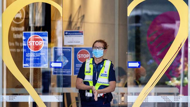 Police at the Novotel “hot hotel”, where positive cases are quarantined in Melbourne. Picture: NCA NewsWire/David Geraghty