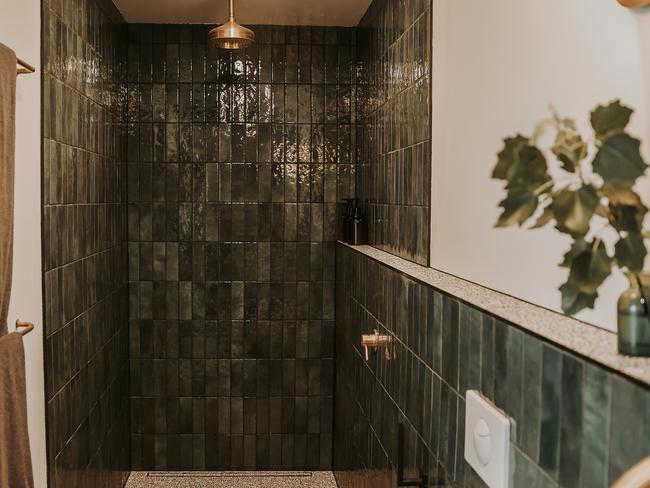 Braithwaite bathroom features large walk-in rain shower with forest green tiles on the walls and terrazzo tiles on the floors. Picture: Renee Thurston