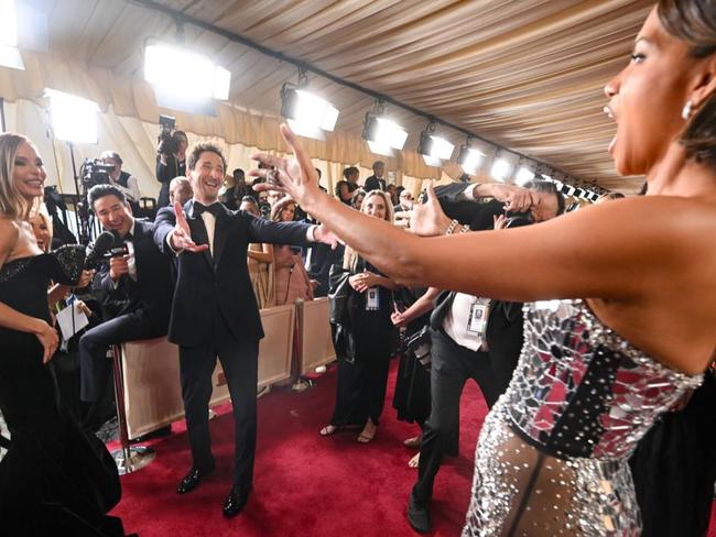 NEWS OF THE WEEK: Halle Berry gets 'payback' by planting kiss on Adrien Brody at Academy Awards