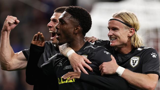 Al Hassan Toure of Macarthur FC celebrates scoring a penalty with teammates during the Australia Cup Final match between Sydney United 58 FC and Macarthur FC at Allianz Stadium. Pic: Cameron Spencer/Getty Images