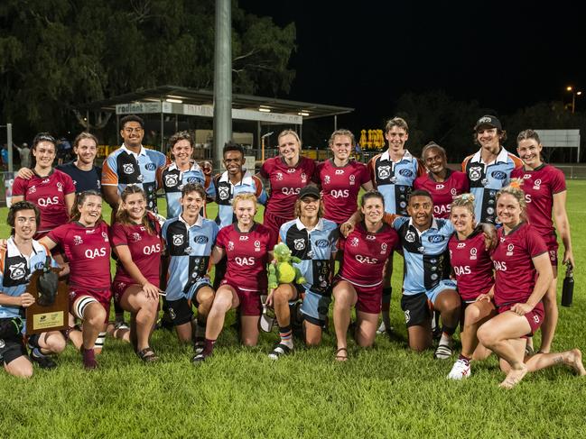 Queensland Academy of Sport women celebrate their Jabiru Cup victory, also with East Arnhem men's players in the shot. Picture: NT Rugby