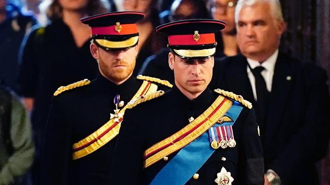 Spot the real man: Princes Harry and William.