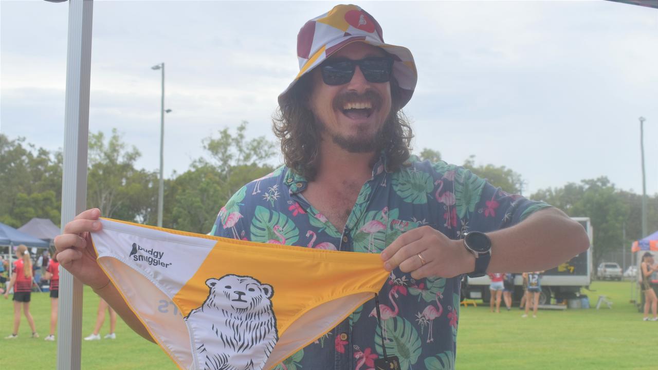 Corey Dellit shows off a pair of Bundy trunks from the Budgy Smuggler stall.