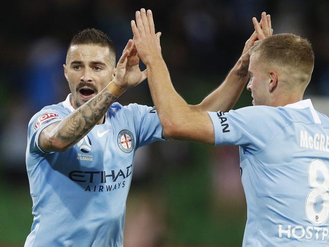 Jamie Maclaren of Melbourne City (left) celebrates after scoring a goal during the Round 18 A-League match between Melbourne City and Adelaide United at AAMI Park in Melbourne, Saturday, February 9, 2019. (AAP Image/Daniel Pockett) NO ARCHIVING, EDITORIAL USE ONLY