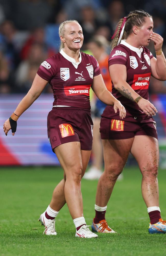 Emily Bass of the Maroons smiles as she celebrates scoring a try during game one of the Women's State of Origin series. Picture: Getty Images