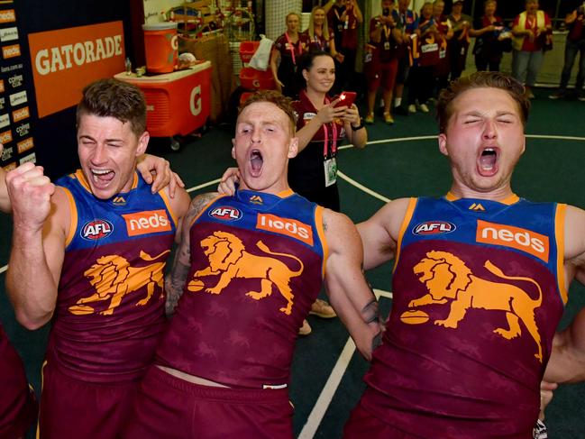 (Left to right) Jarryd Lyons, Dayne Zorko, Mitch Robinson and Alex Witherden of the Lions celebrate winning the Round 22 AFL match between the Brisbane Lions and the Geelong Cats at the Gabba in Brisbane, Saturday, August 17, 2019.  (AAP Image/Darren England) NO ARCHIVING, EDITORIAL USE ONLY