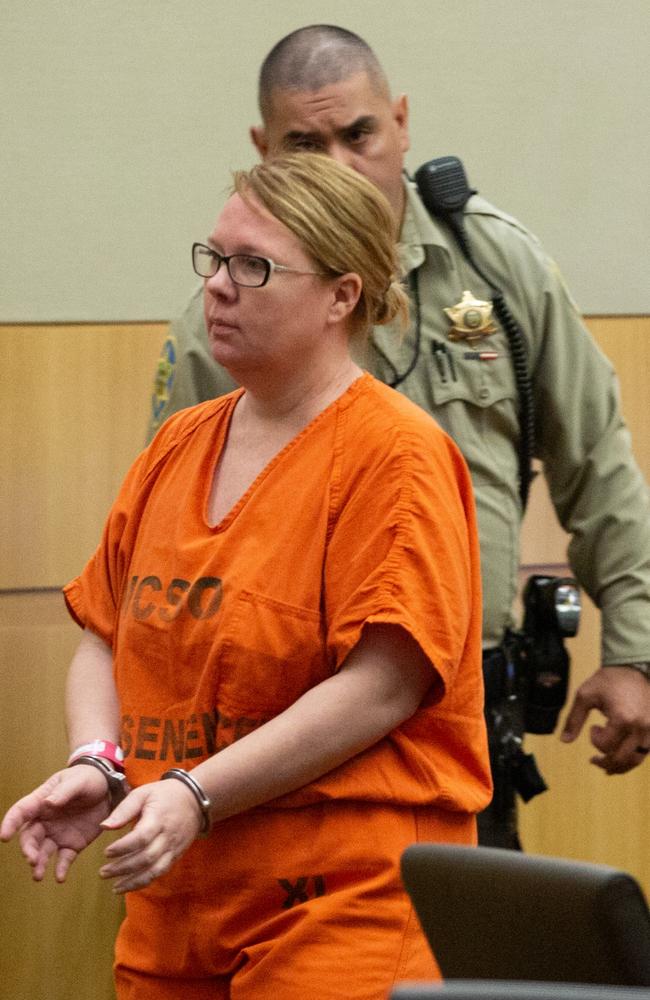 Defendant Lisa Cunningham is escorted back to a holding cell by Maricopa County Sherriff's officers on September 12, 2018. Picture: Caitlin O'Hara/ News Corp Australia