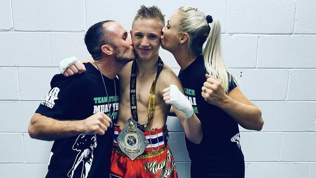 Dre Stalder celebrates winning and Australian Muay Thai title with his parents Brodie and Elise Stalder. Picture: Contributed