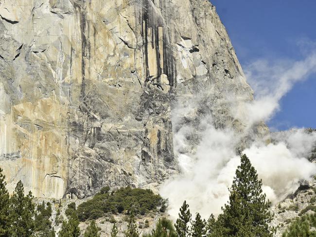 In this Wednesday Sept. 27, 2017, photo provided the National Park Service, a cloud of dust is seen on El Capitan after a major rock fall in Yosemite National Park, Calif. An official says the man killed when a massive hunk of rock fell of Yosemite National Park's El Capitan monolith was a British climber. Yosemite park ranger and spokesman Scott Gediman said Thursday that the man was with a British woman who was seriously injured. (Tom Evans/National Park Service via AP)