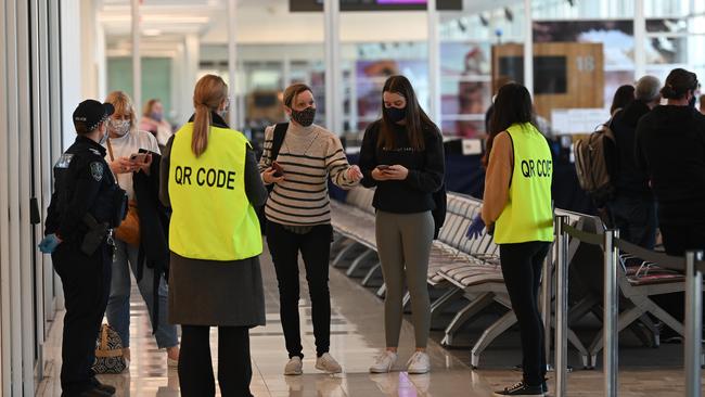 Passengers at Adelaide Airport when the last lot of restrictions were enforced in June. Picture: NCA NewsWire / Naomi Jellicoe