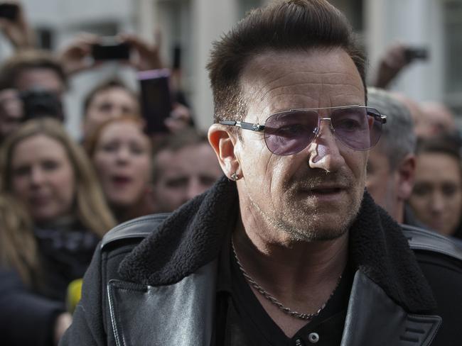 Naturally, Bono was there ... U2 frontman Bono arrives at a west London studio to record the new Band Aid 30 single. Picture: AFP PHOTO / ANDREW COWIE