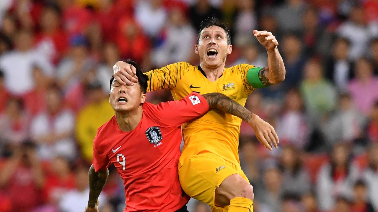 Socceroos captain Mark Milligan will miss Australia’s first qualification match for the 2022 World Cup. (AAP Image/Darren England)