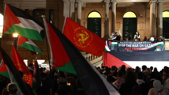 Pro-Palestinian protesters hold banners and flags as they listen to speakers at a rally held to mark the anniversary of the ‘Nakba’ or ‘catastrophe’ of 1948, in Sydney on Wednesday. Picture: David Gray/AFP