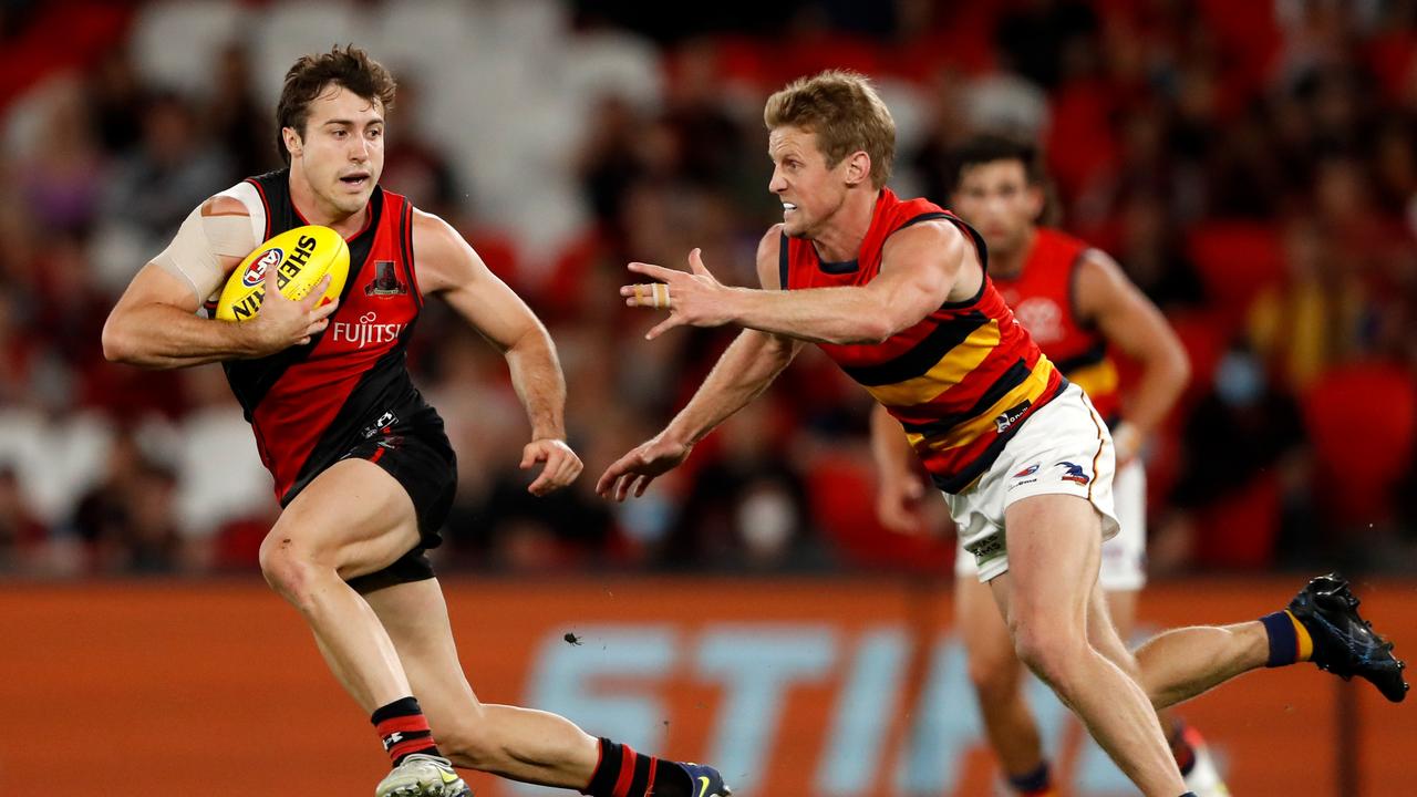 Rory Sloane chases Andrew McGrath. Picture: Dylan Burns/AFL Photos via Getty Images