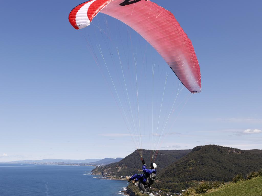 The 93-year-old paraglider is pictured taking off at Stanwell Park, Sydney’s unofficial home of the sport about 58km south of the capital. Picture: Jonathan Ng