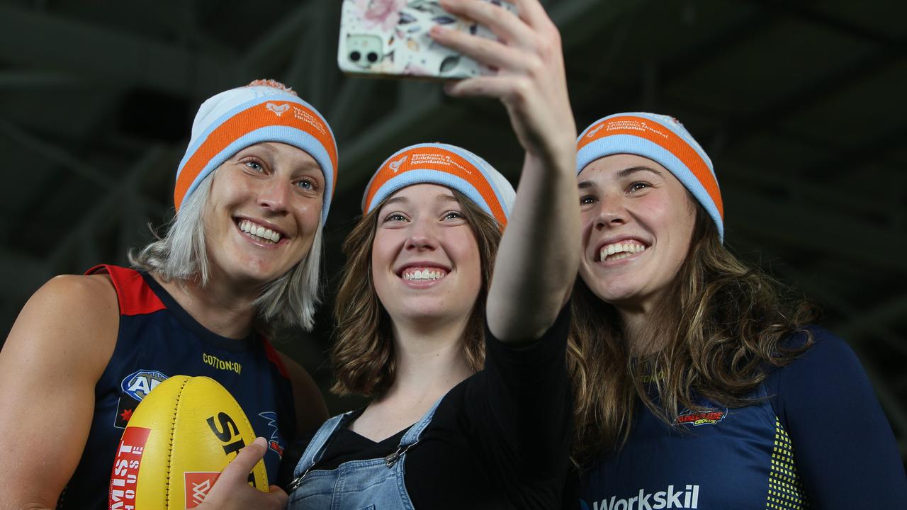 Teiana Marsh takes a selfie with Crows AFLW Players Marijana Rajcic and Najwa Allen. Picture: Emma Brasier