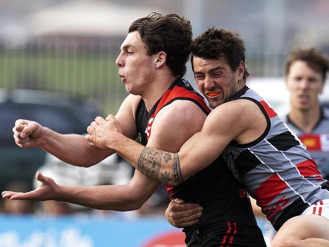 North Launceston’s Jackson Callow is tackled by Lauderdale’s Robbie McManus. Picture: CHRIS KIDD