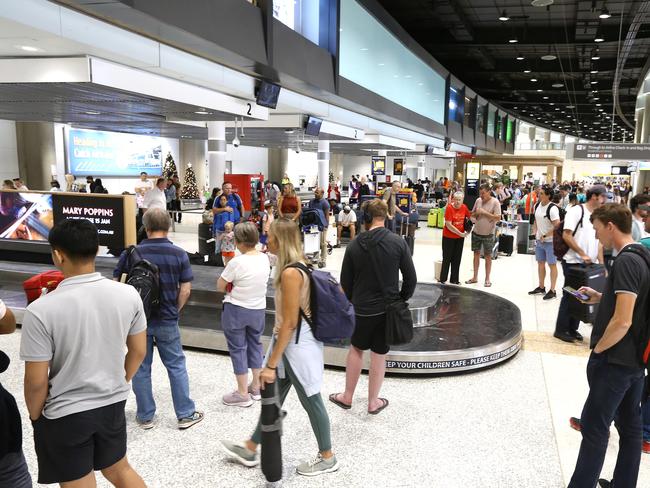 Brisbane Domestic Airport is looking quite ahead of a last minute Christmas flight rush, and Santa Rudolf and Candy Cane Elf Isabella were there to put put some cheer into passengers day. Eagle Farm Thursday 22nd December 2022  Picture David Clark